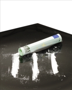 Cocaine on black table with 100 euro